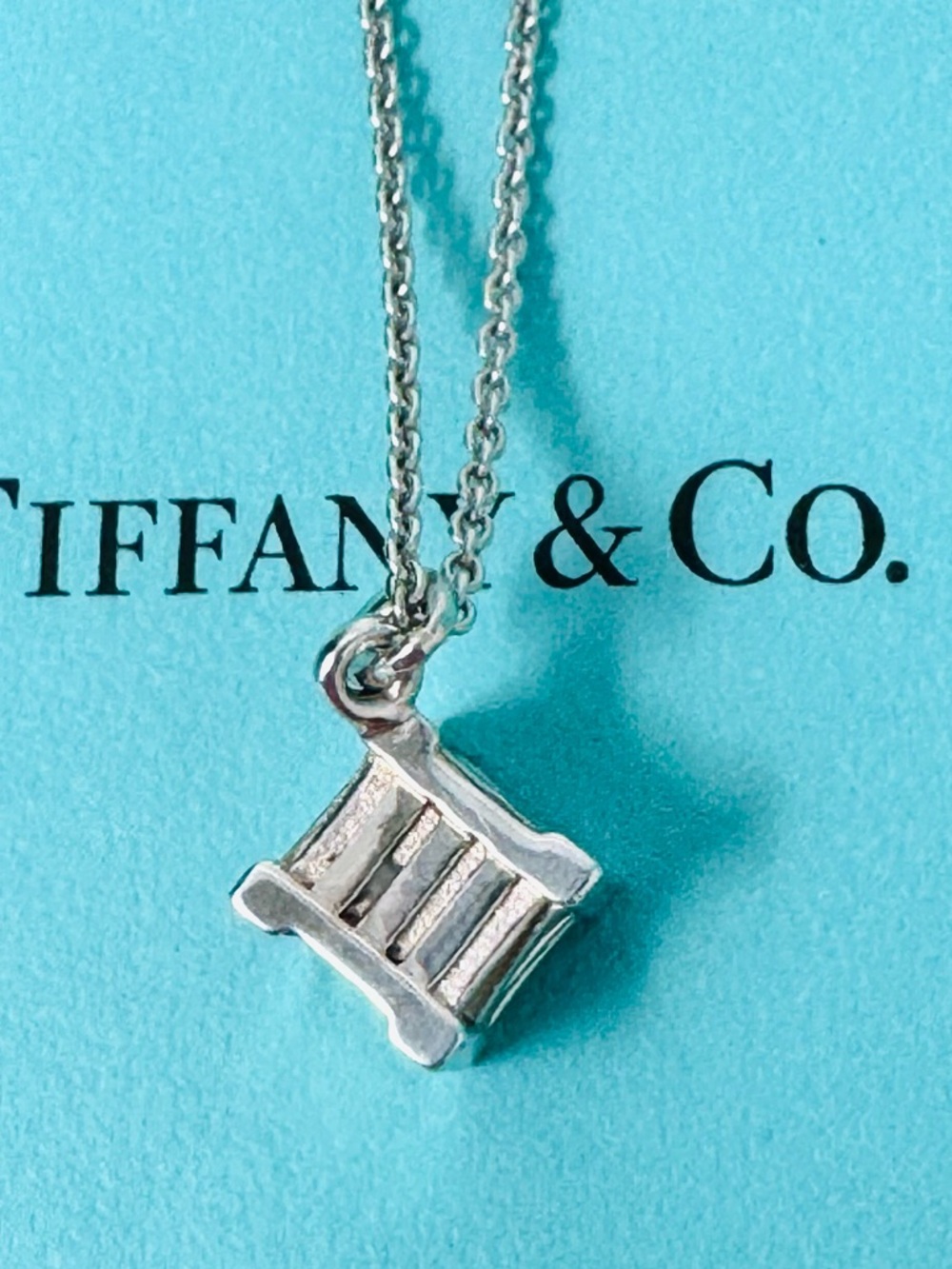 Authentic Tiffany & Co. Roman Numbers Atlas Cube Pendant Necklace.